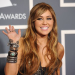 Singer Miley Cyrus arrives at The 53rd Annual GRAMMY Awards bracelets