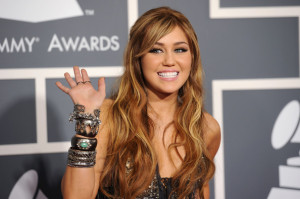 Singer Miley Cyrus arrives at The 53rd Annual GRAMMY Awards bracelets